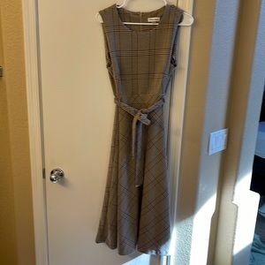 Calvin Klein size 10 new with tags. Stretchy fabric, midi length.